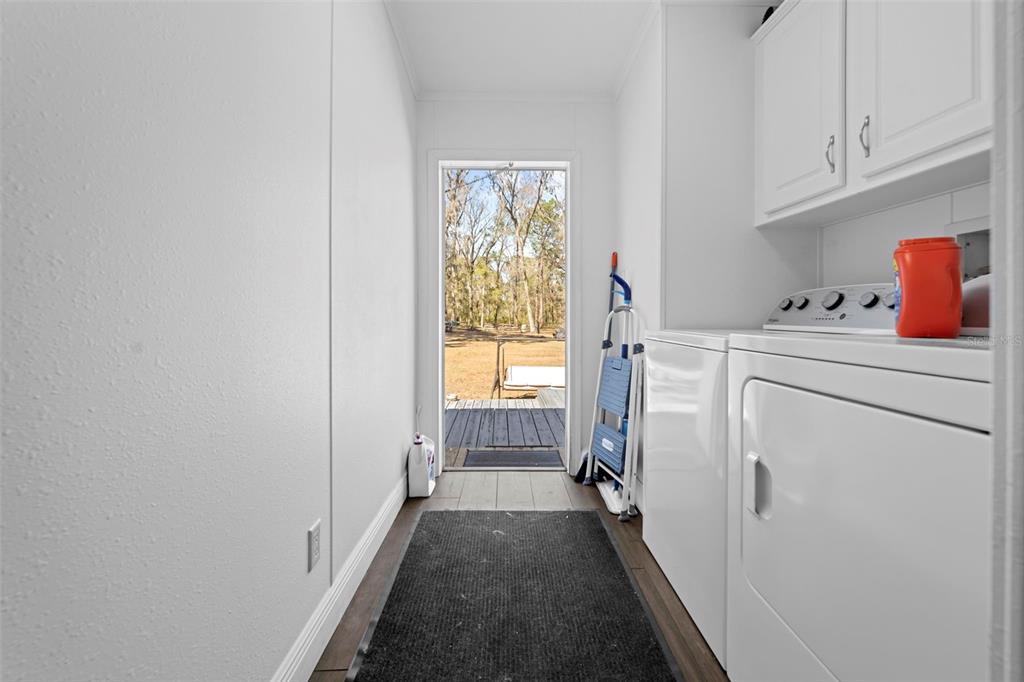 17095 Frankfort Road Brooksville, FL 34601 - Photo 39 of 42 a view of utility room with washer and dryer