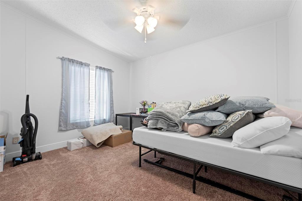 17095 Frankfort Road Brooksville, FL 34601 - Photo 41 of 42 a living room with furniture and a window