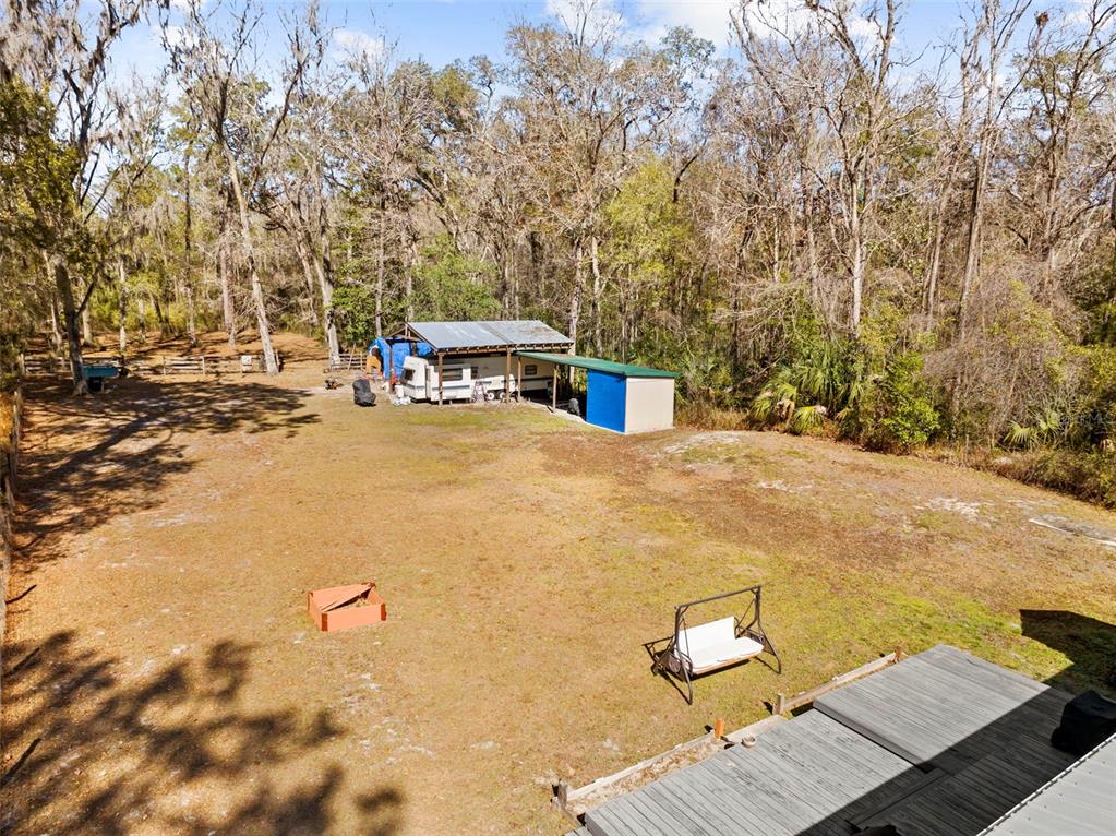 17095 Frankfort Road Brooksville, FL 34601 - Photo 9 of 42 a view of a yard with swimming pool