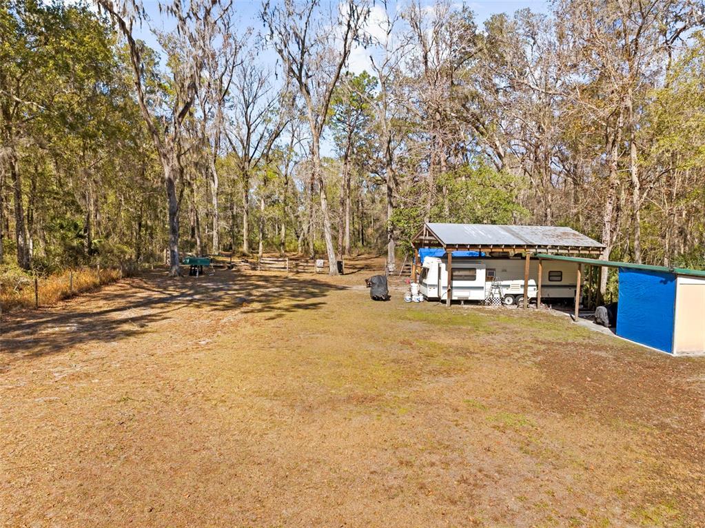 17095 Frankfort Road Brooksville, FL 34601 - Photo 10 of 42 a yellow house with trees in front of it