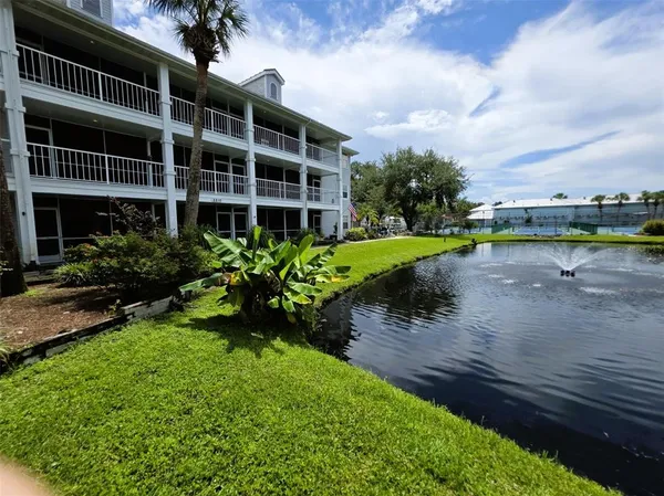 a view of a lake with a yard