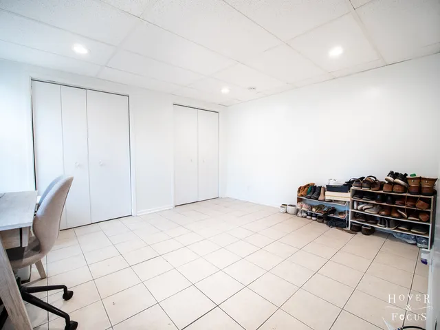 a room with a chair and white walls