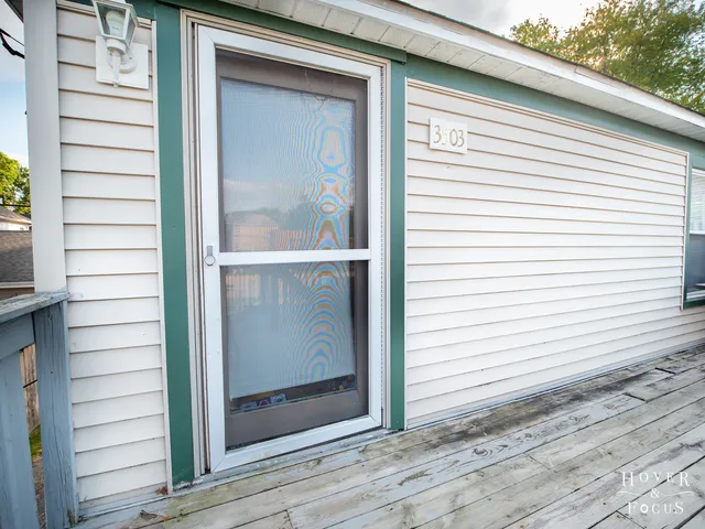 a view of a door and a window