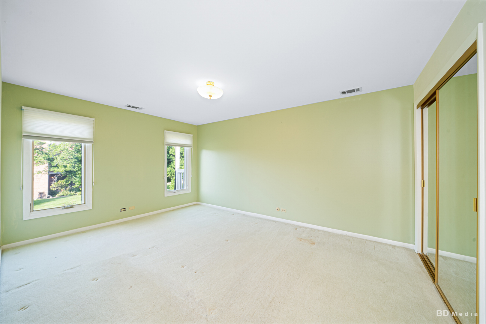 1477 South County Farm Road, Unit 23F Wheaton, IL 60189 - Photo 15 of 27 an empty room with windows