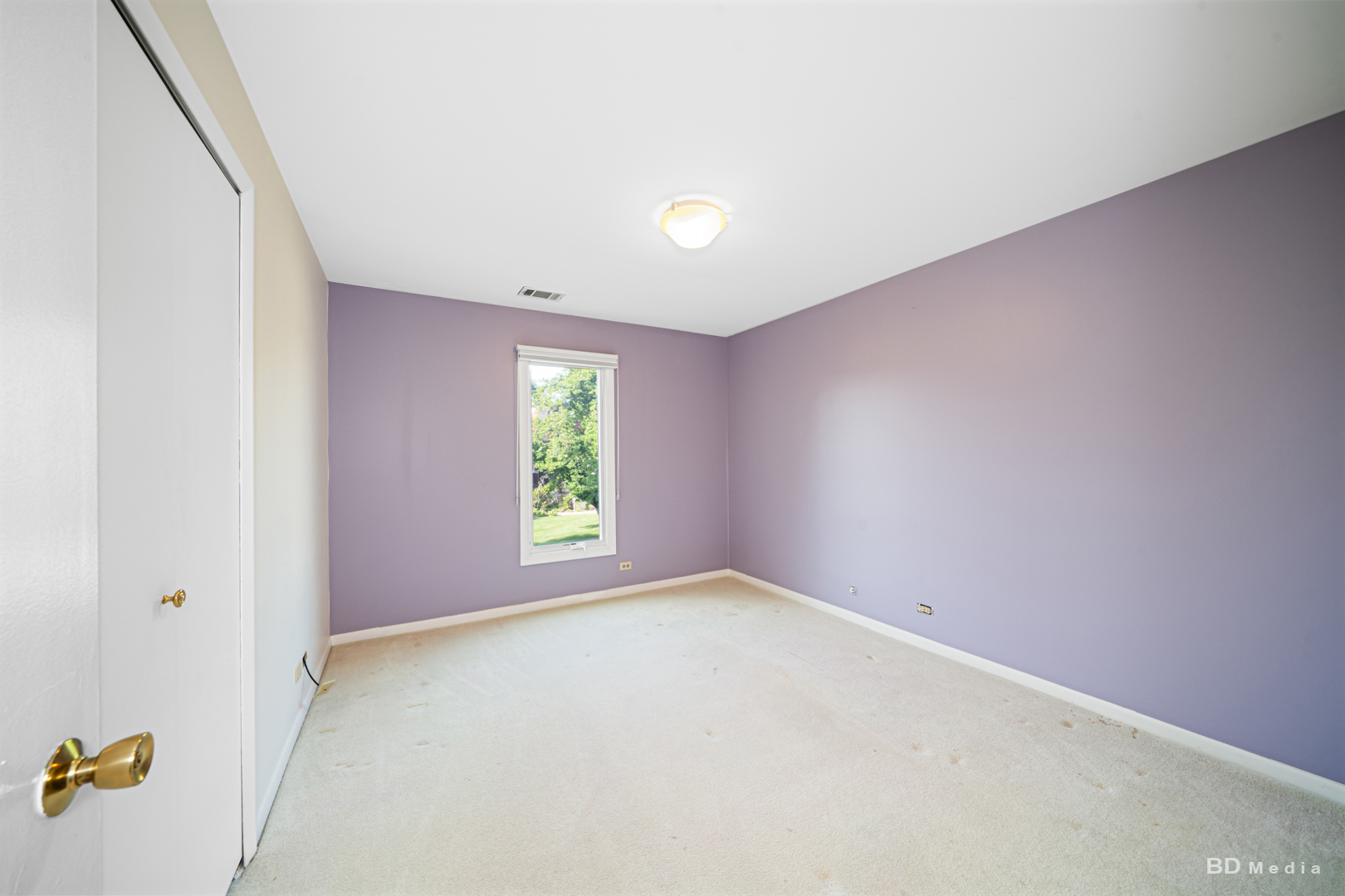 1477 South County Farm Road, Unit 23F Wheaton, IL 60189 - Photo 19 of 27 an empty room with windows