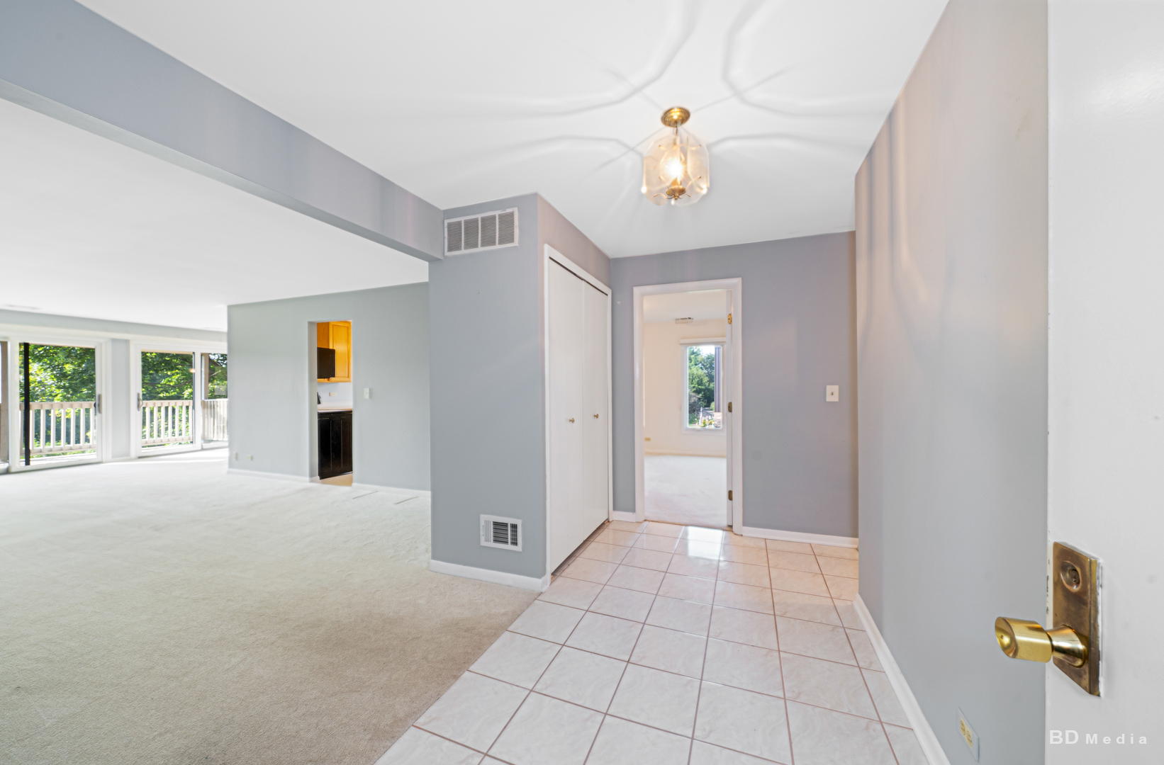 1477 South County Farm Road, Unit 23F Wheaton, IL 60189 - Photo 2 of 27 a view of an empty room with a window