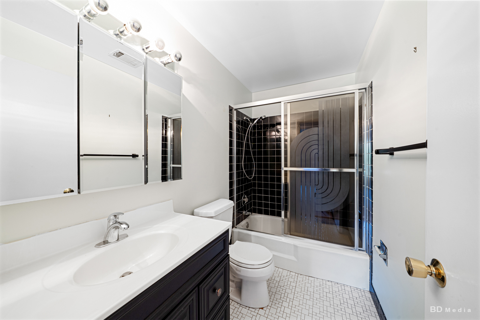 1477 South County Farm Road, Unit 23F Wheaton, IL 60189 - Photo 22 of 27 a bathroom with a sink toilet and shower