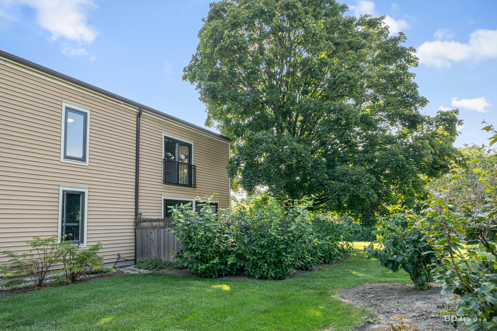 1477 South County Farm Road, Unit 23F Wheaton, IL 60189 - Photo 24 of 27 a view of a house with a yard