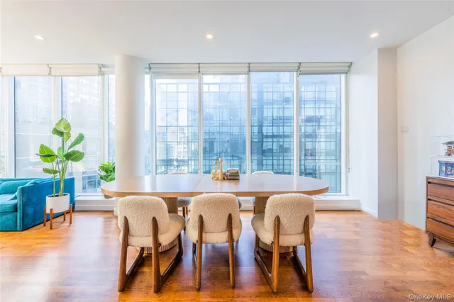 a view of a dining room with furniture window and wooden floor