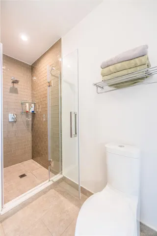 a bathroom with a toilet and shower