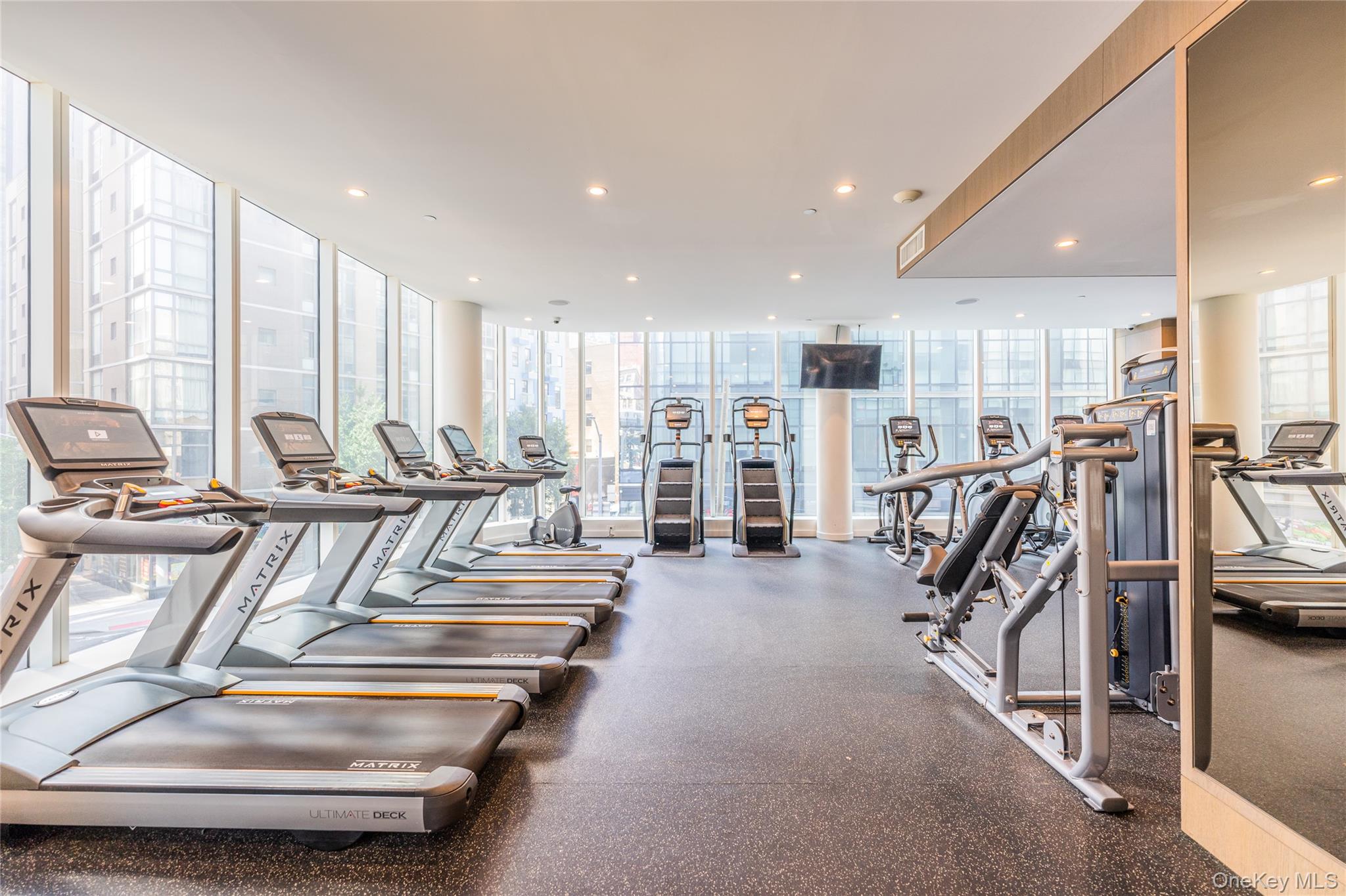 27-17 42nd Road, Unit 7E Queens, NY 11101 - Photo 26 of 42 a view of a room with gym equipment