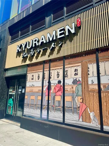 a view of a cafe with glass door