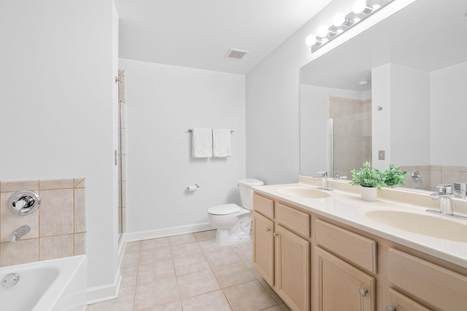 1529 South State Street, Unit 22K Chicago, IL 60605 - Photo 17 of 20 a spacious bathroom with a sink a toilet and shower