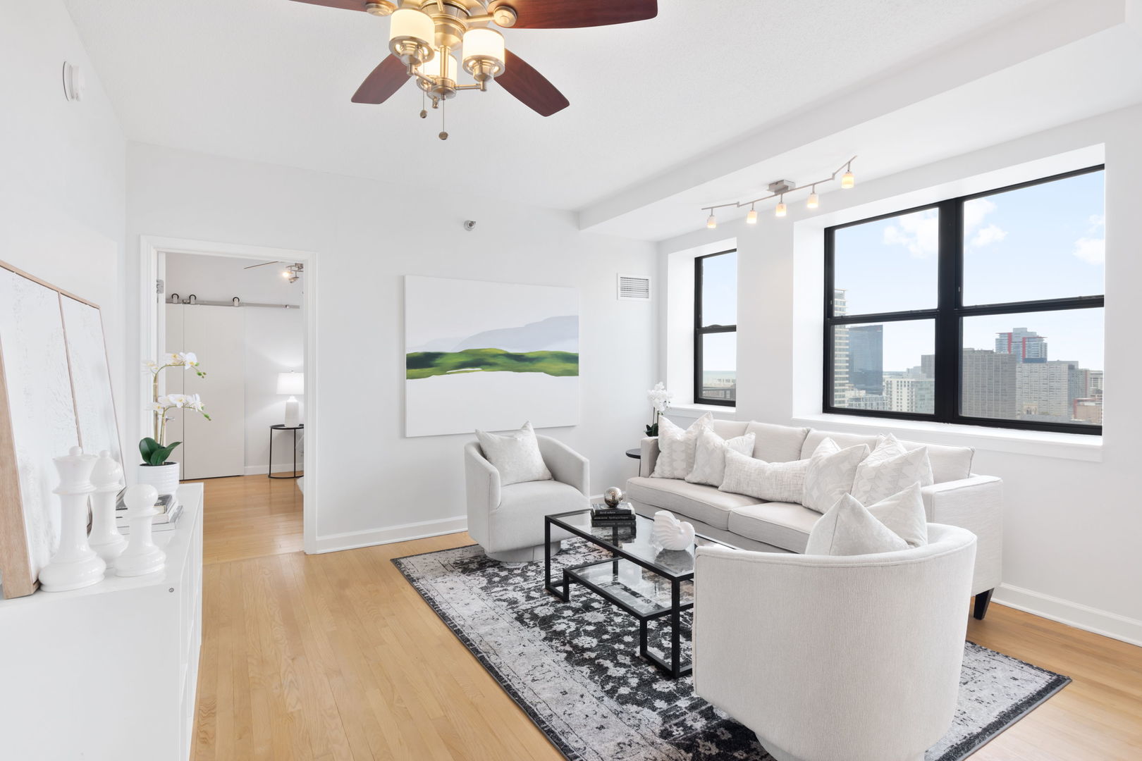 1529 South State Street, Unit 22K Chicago, IL 60605 - Photo 3 of 20 a living room with furniture and a large window