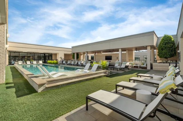 a patio with patio couch and chairs