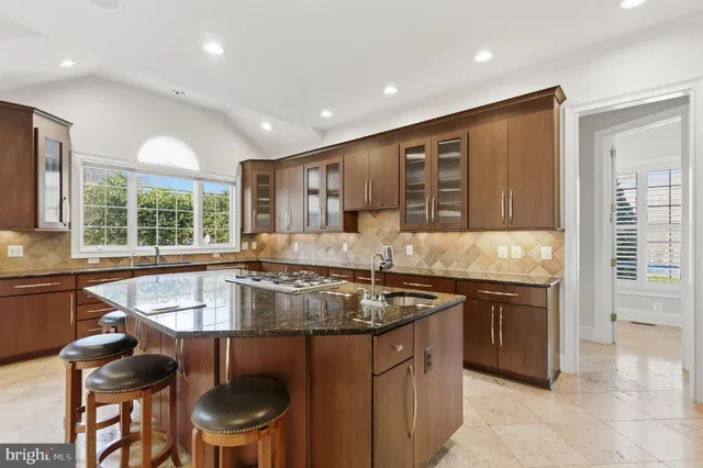 a view of a livingroom with a ceiling fan and window