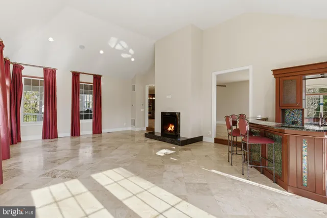 a bathroom with a sink toilet a mirror and shower