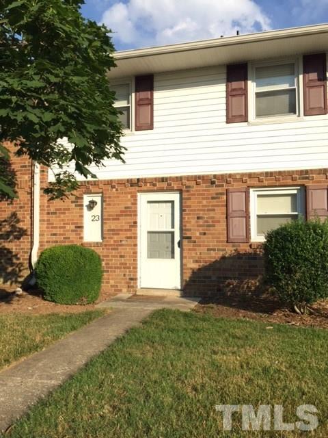 5141 Revere Road, Unit 23 Durham, NC 27713 - Photo 1 of 20 a view of a house with a yard and plants