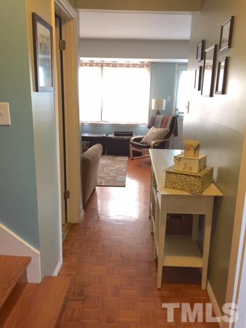5141 Revere Road, Unit 23 Durham, NC 27713 - Photo 2 of 20 a living room with furniture and a fireplace