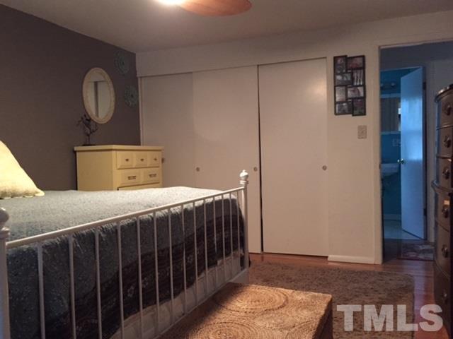 5141 Revere Road, Unit 23 Durham, NC 27713 - Photo 15 of 20 a bedroom with a bed and cabinets