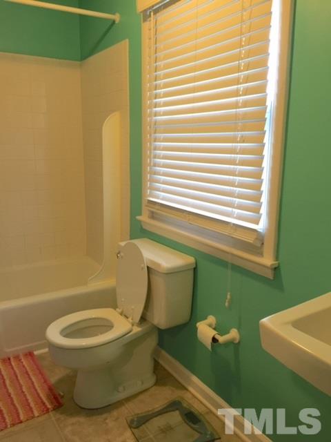 5141 Revere Road, Unit 23 Durham, NC 27713 - Photo 18 of 20 a bathroom with a toilet and a bathtub