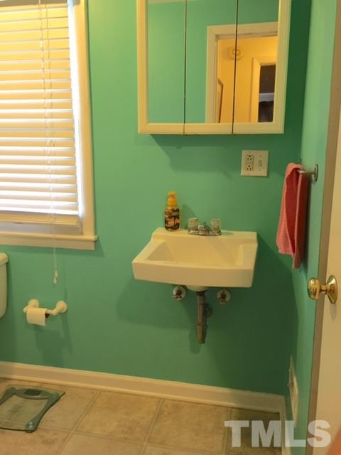 5141 Revere Road, Unit 23 Durham, NC 27713 - Photo 19 of 20 a bathroom with a sink and a mirror