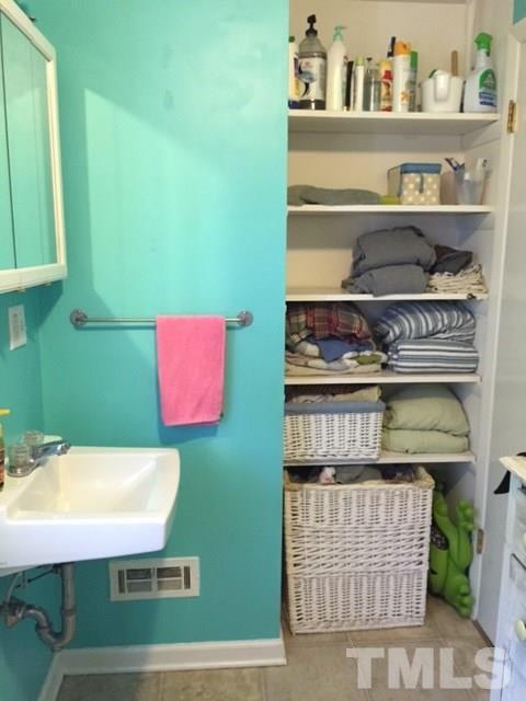 5141 Revere Road, Unit 23 Durham, NC 27713 - Photo 20 of 20 a kitchen with a refrigerator and a more cabinets