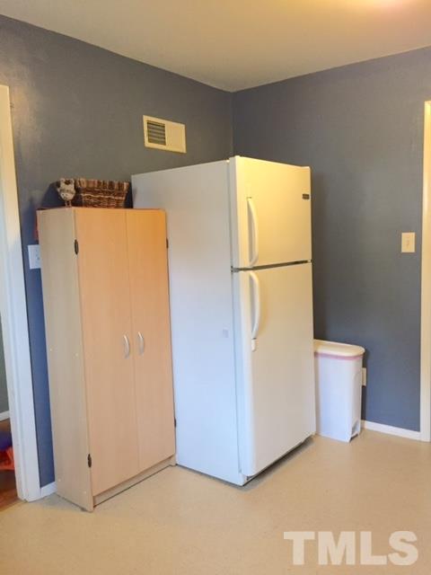 5141 Revere Road, Unit 23 Durham, NC 27713 - Photo 5 of 20 a white refrigerator freezer sitting in a kitchen