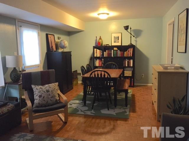5141 Revere Road, Unit 23 Durham, NC 27713 - Photo 9 of 20 a living room with furniture a dining table and a piano