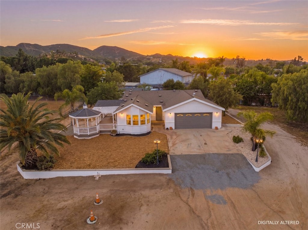 an aerial view of a house with a garden