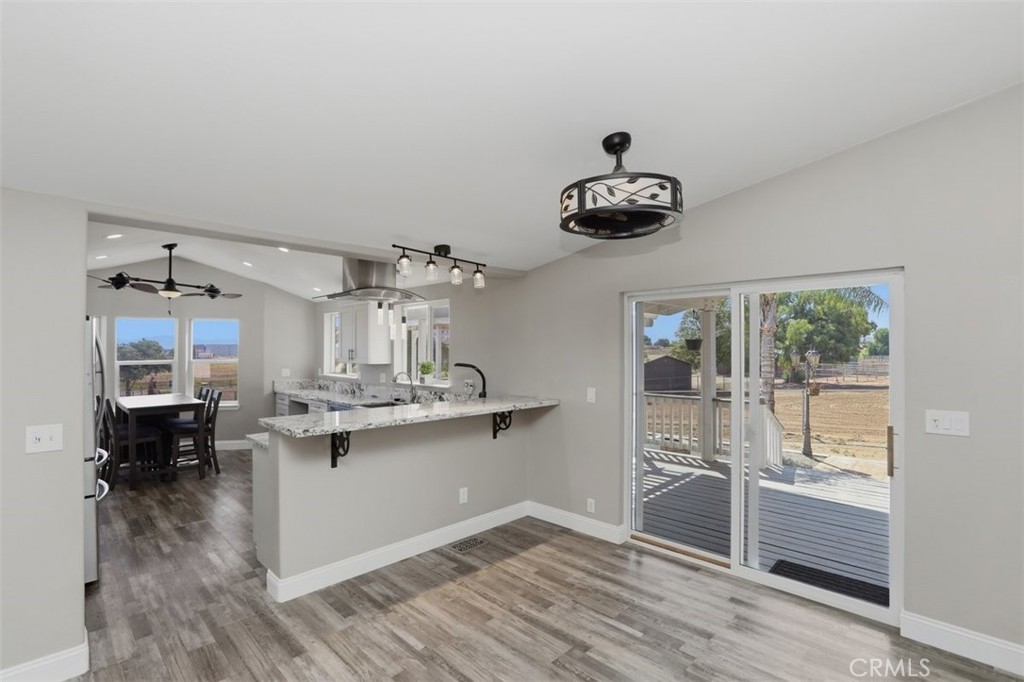33634 Howard Way Menifee, CA 92584 - Photo 13 of 53 a kitchen with stainless steel appliances granite countertop a stove and a refrigerator