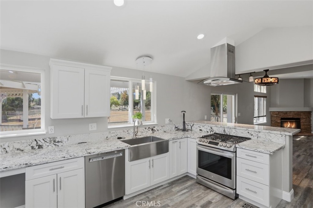 33634 Howard Way Menifee, CA 92584 - Photo 15 of 53 a kitchen that has a sink and a stove