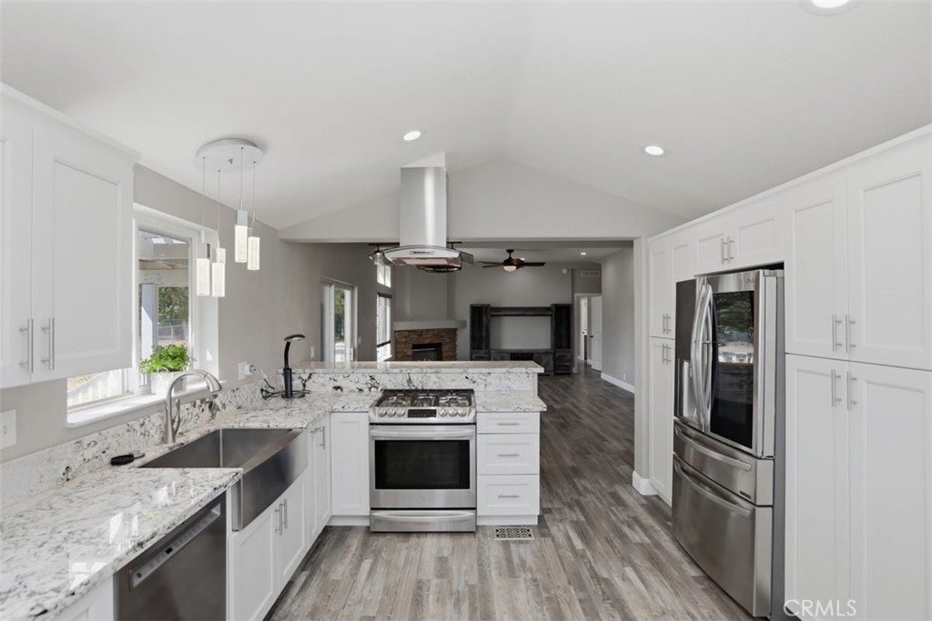 33634 Howard Way Menifee, CA 92584 - Photo 18 of 53 a kitchen with a sink stove and refrigerator