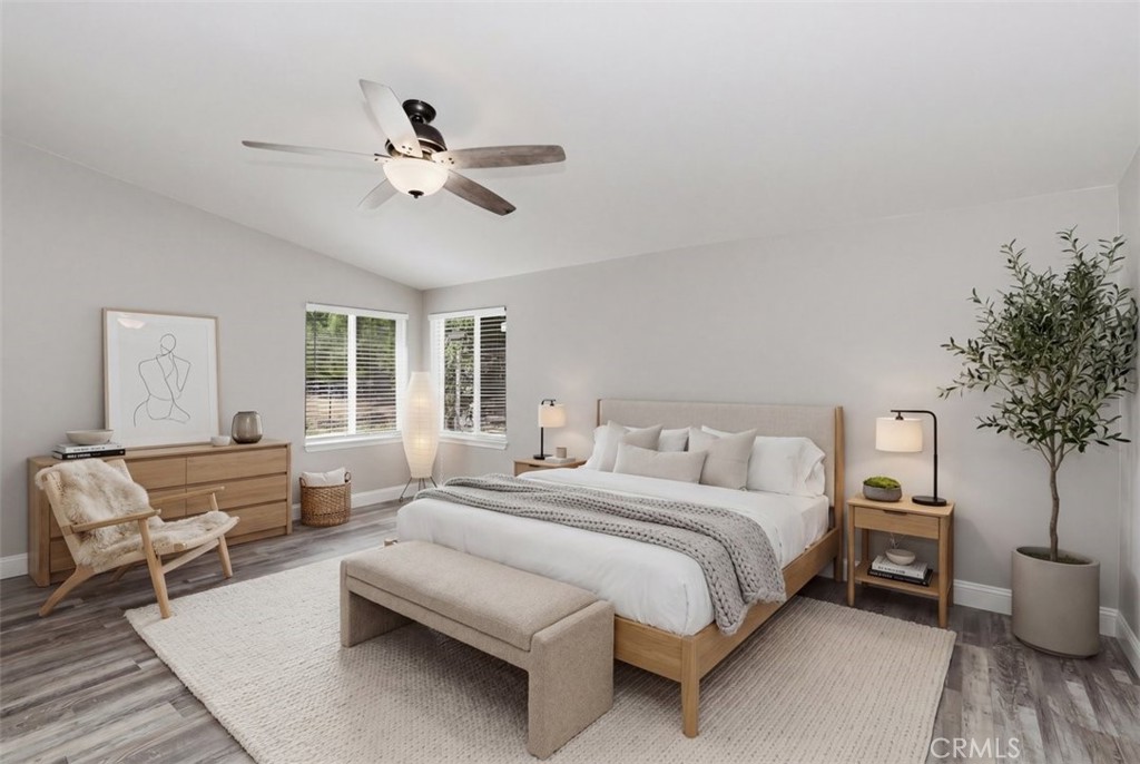 33634 Howard Way Menifee, CA 92584 - Photo 20 of 53 a bedroom with a bed and a chandelier