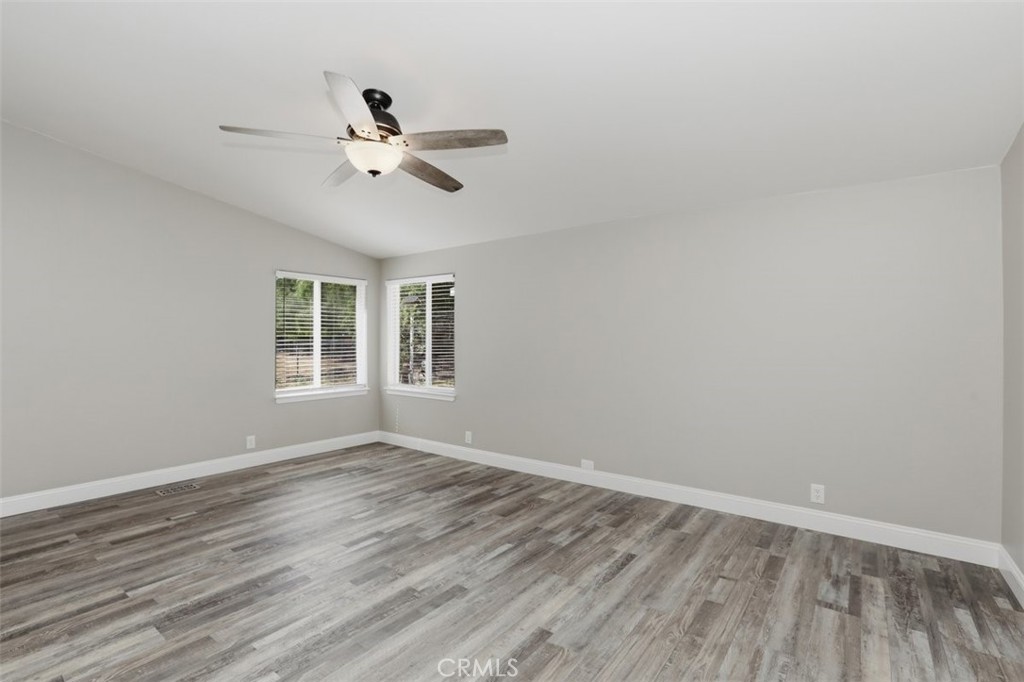 33634 Howard Way Menifee, CA 92584 - Photo 21 of 53 a view of empty room with wooden floor and fan