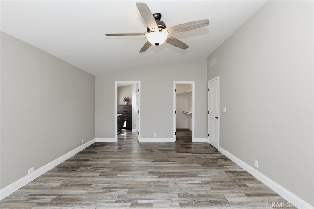 33634 Howard Way Menifee, CA 92584 - Photo 22 of 53 a view of an empty room with wooden floor