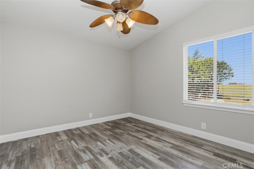 33634 Howard Way Menifee, CA 92584 - Photo 28 of 53 a view of an empty room with wooden floor and a window