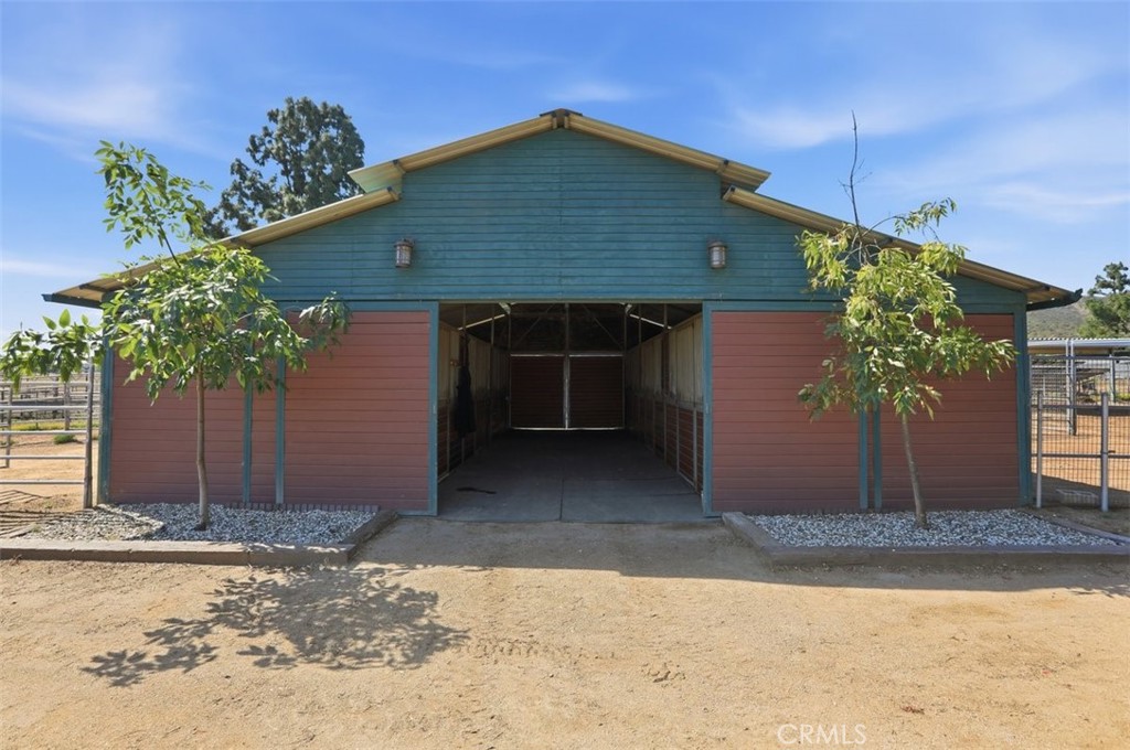 33634 Howard Way Menifee, CA 92584 - Photo 3 of 53 a front view of a house with a yard and garage