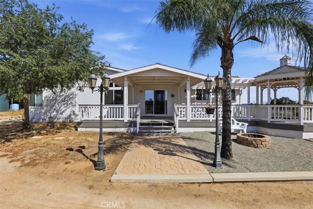 33634 Howard Way Menifee, CA 92584 - Photo 35 of 53 front view of a house with a yard