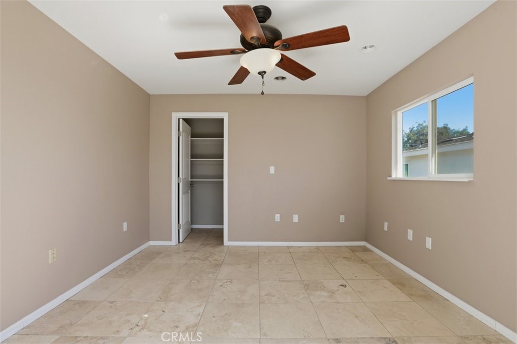 33634 Howard Way Menifee, CA 92584 - Photo 37 of 53 a view of an empty room with a ceiling fan