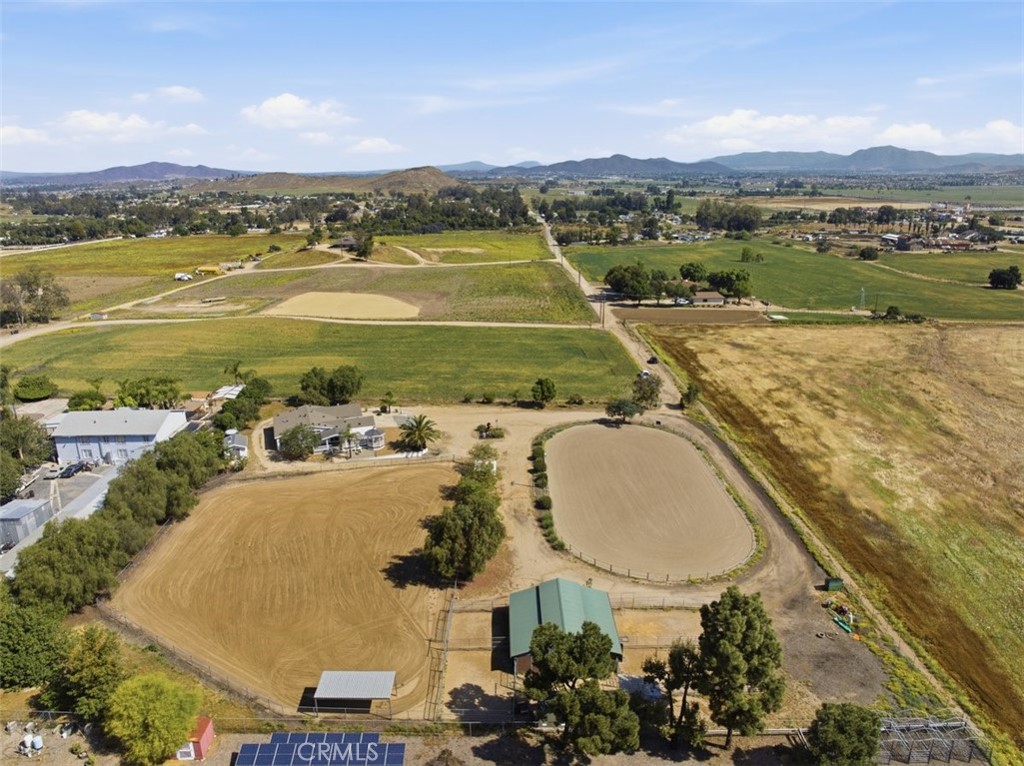 33634 Howard Way Menifee, CA 92584 - Photo 42 of 53 an aerial view of a house with outdoor space swimming pool and mountains
