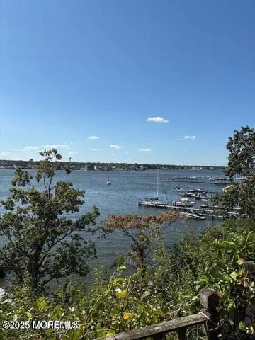a view of a large body of water with a building in the background