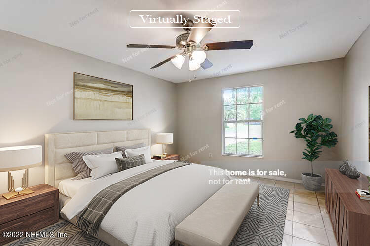 1663 Rhonda Drive Middleburg, FL 32068 - Photo 3 of 24 a bedroom with a large bed and a chandelier