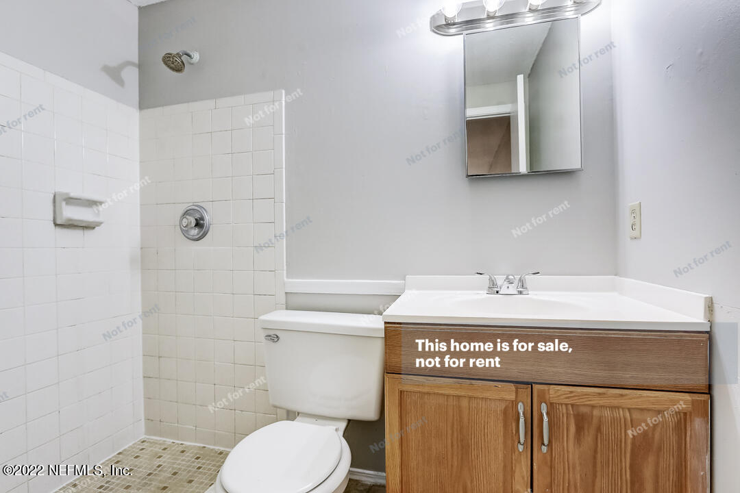 1663 Rhonda Drive Middleburg, FL 32068 - Photo 8 of 24 a bathroom with a sink a toilet and shower