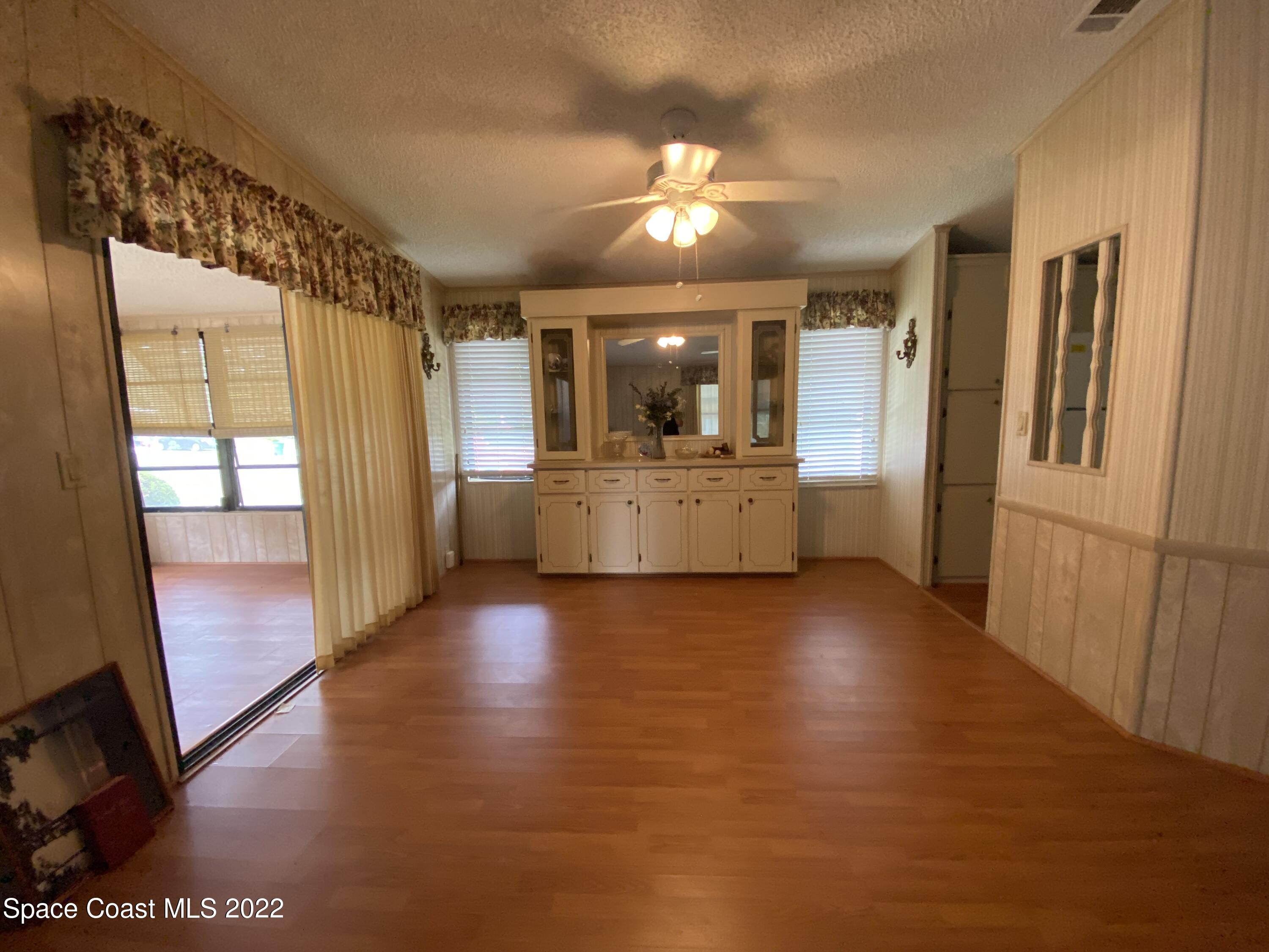 1352 Barefoot Circle Barefoot Bay, FL 32976 - Photo 12 of 40 a view of a refrigerator in kitchen and a window