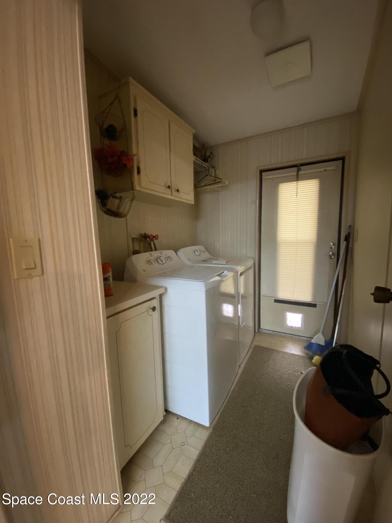 1352 Barefoot Circle Barefoot Bay, FL 32976 - Photo 25 of 40 a utility room with dryer and washer