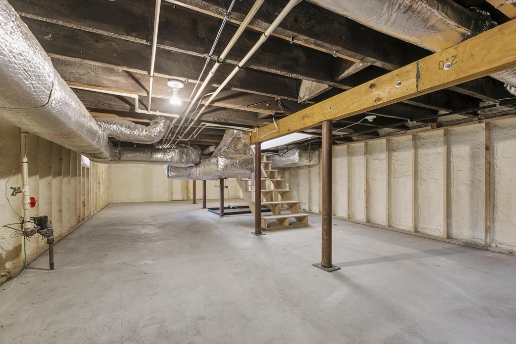 591 Somerville Avenue, Unit 7 Somerville, MA 02143 - Photo 14 of 20 a view of empty room with wooden walls