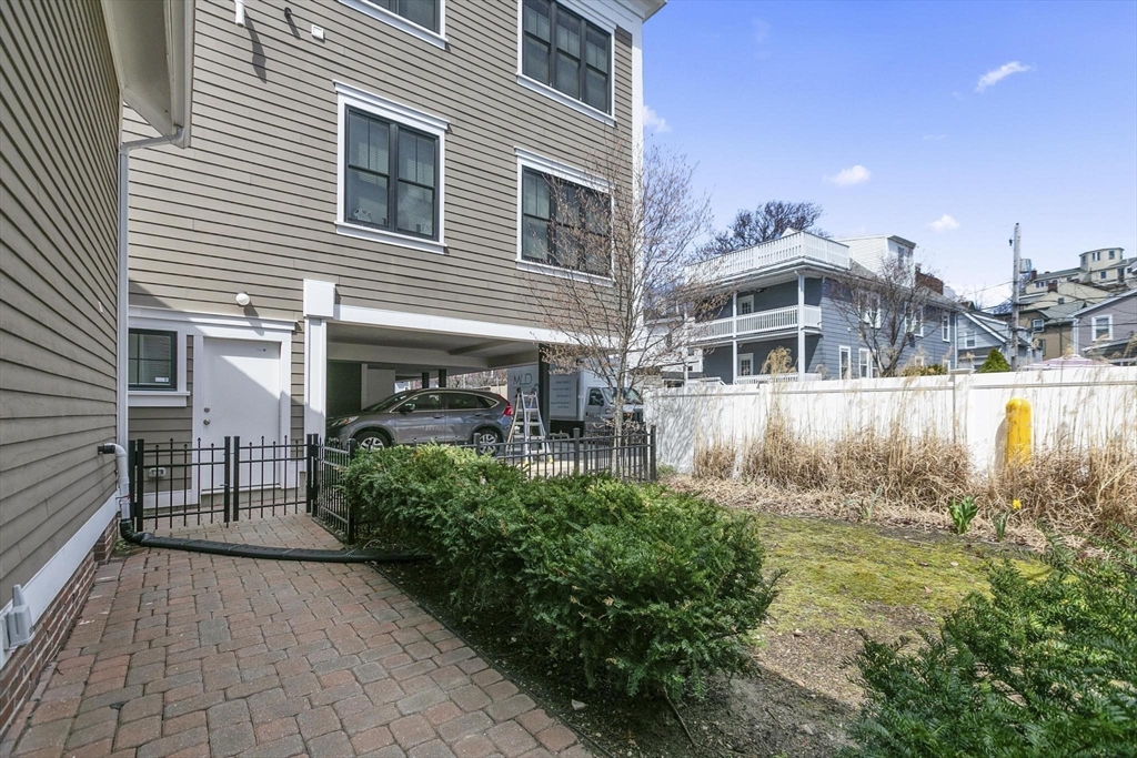 591 Somerville Avenue, Unit 7 Somerville, MA 02143 - Photo 15 of 20 a view of a house with backyard and sitting area