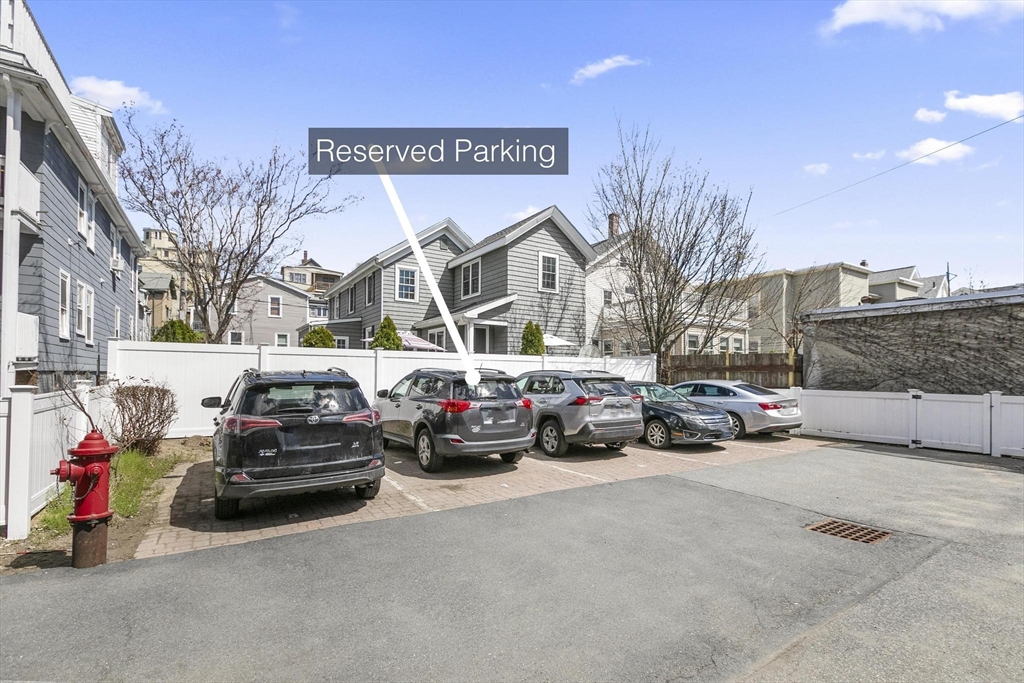 591 Somerville Avenue, Unit 7 Somerville, MA 02143 - Photo 18 of 20 a view of a cars park in front of a building