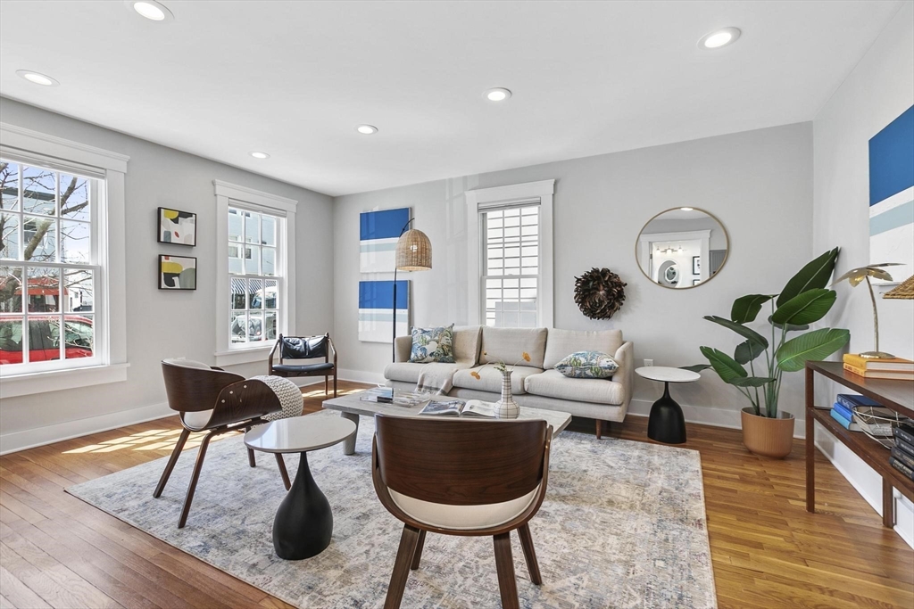 591 Somerville Avenue, Unit 7 Somerville, MA 02143 - Photo 5 of 20 a living room with furniture a rug and a window